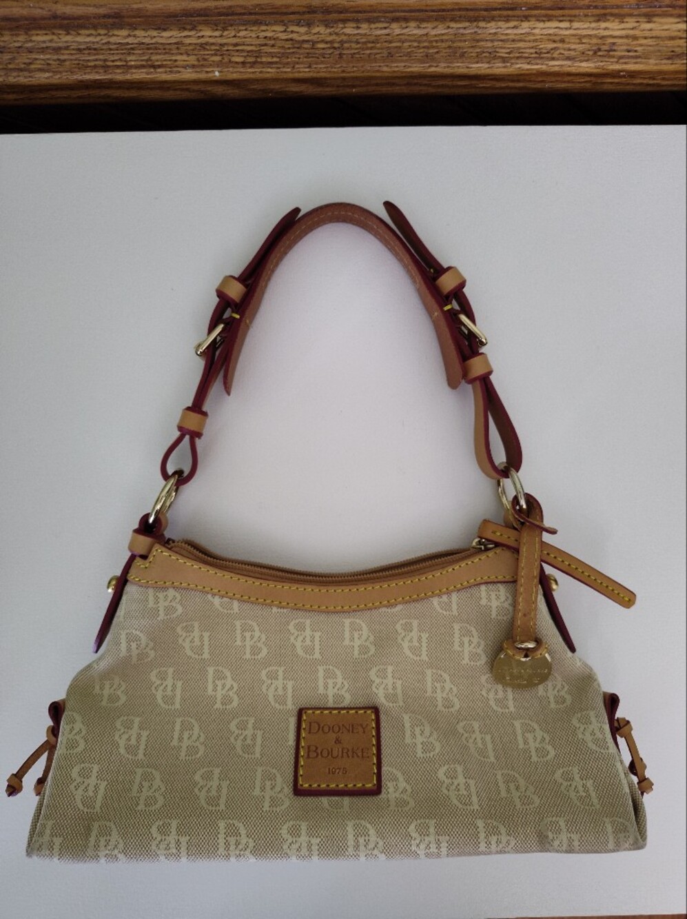 Dooney & Bourke Beige Canvas Mini East/West Slouch Bag with Tan Leather Trim